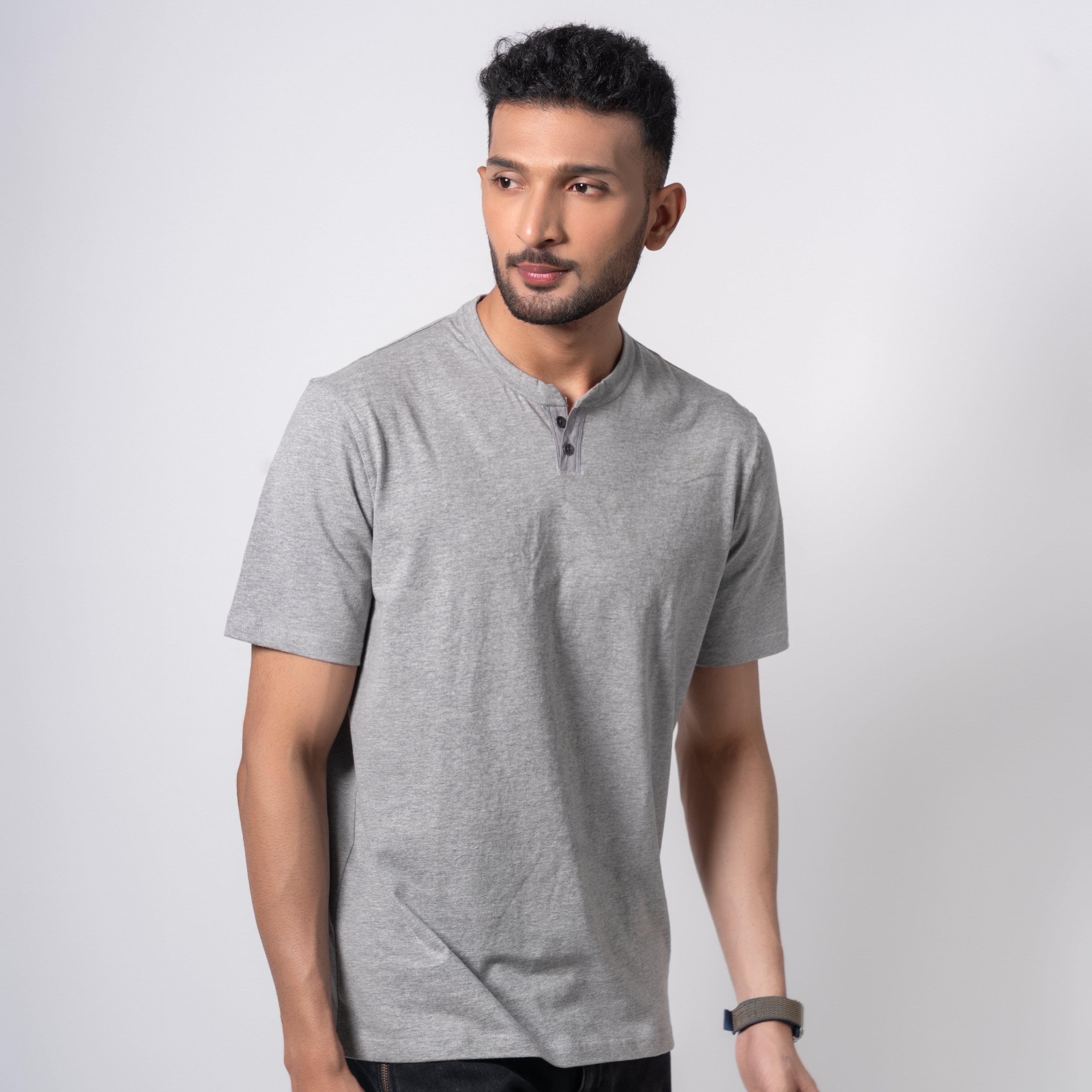 Man wearing a gray t-shirt on a white background