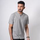 Man wearing a gray t-shirt on a white background